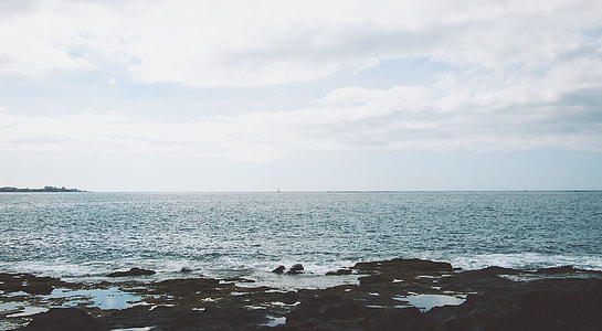 photography of sand near body of water during daytime thumbnail