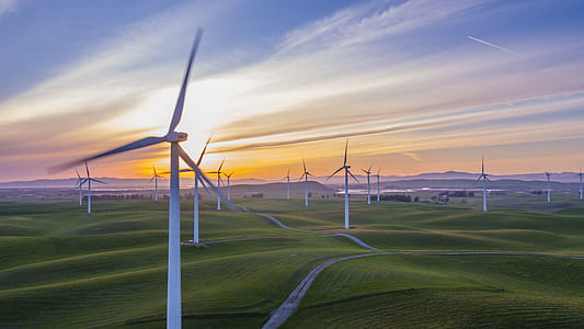 wind turbines during sunset thumbnail