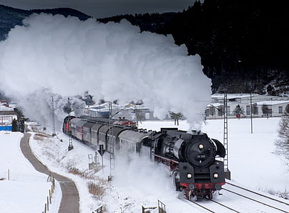 black train on snow trail thumbnail