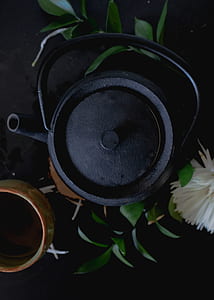 black metal kettle beside bowl thumbnail