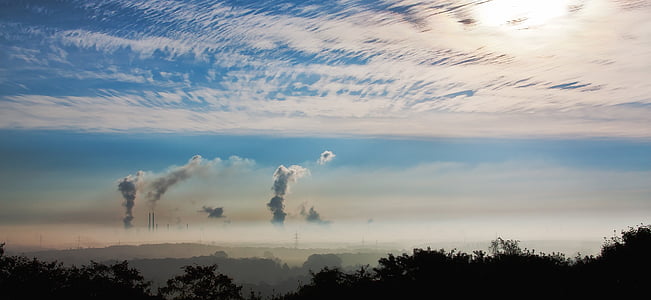 factory chimneys releasing smoke during daytime thumbnail