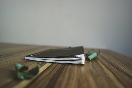 book on wooden surface thumbnail
