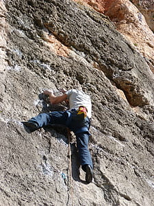 man rock climbing during daytime thumbnail