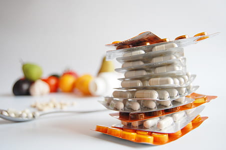 white and orange medicine blister packs stacked thumbnail