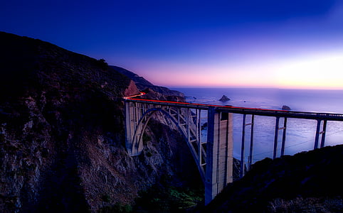 mountain beside bridge during day time thumbnail