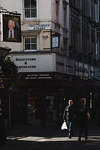 man and woman walking on street thumbnail