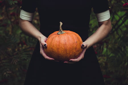 woman holding pumpkin thumbnail