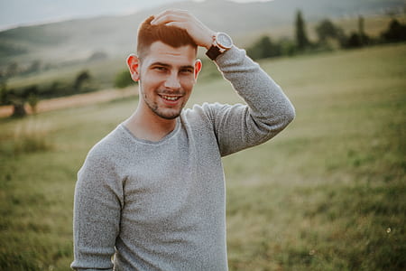 man standing on fielf thumbnail