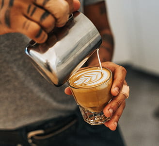 man pouring cream on coffee thumbnail