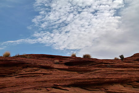 canyon under white clouds and blue sky thumbnail