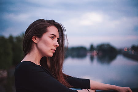 woman standing on balcony thumbnail