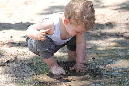 toddler playing on mud thumbnail