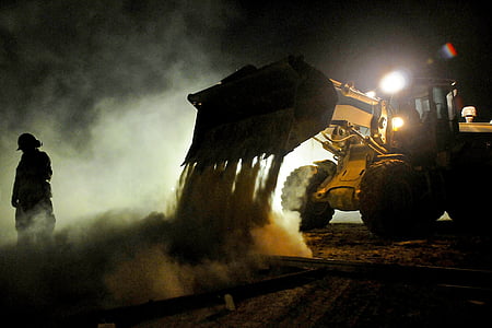 man standing near excavator thumbnail