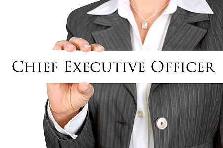 woman in black and grey blazer holding Chief Executive officer sign thumbnail
