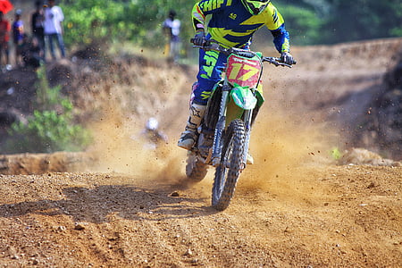 person riding on green motocross dirt bike thumbnail