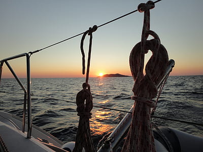 white boat on sea during sunset thumbnail