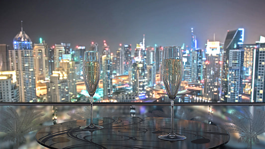 two clear wine glass with metropolis view thumbnail