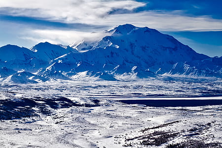 snow capped mountains at daytime thumbnail