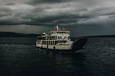 white ship cruising on water thumbnail