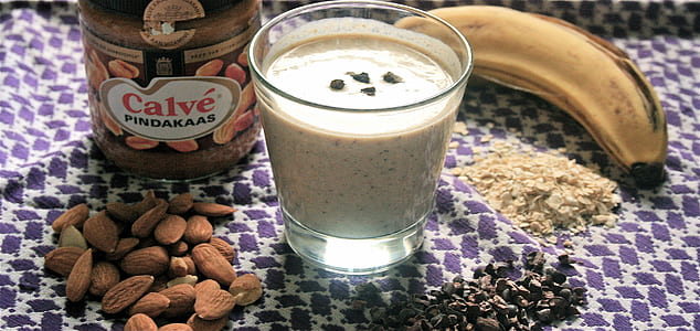 almond nuts beside glass thumbnail