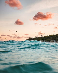 body of water under gray sky thumbnail
