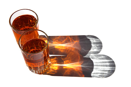 two almost full shot glasses thumbnail
