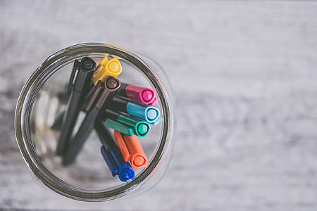 selective focus photo of pens in glass jar thumbnail