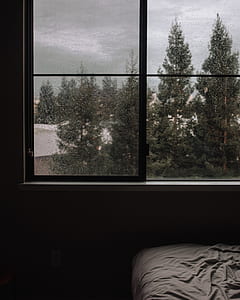 photo of black wooden framed 4-pane glass window in room thumbnail