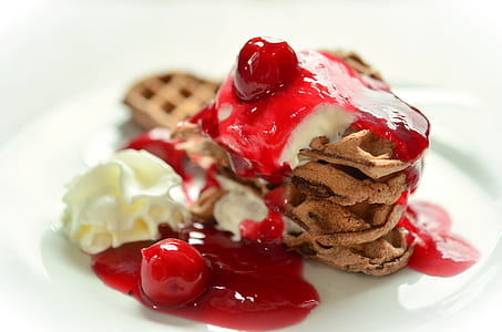 chocolate cake with red syrup on plate thumbnail