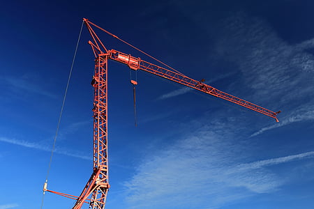 red crane under cloudy sky thumbnail