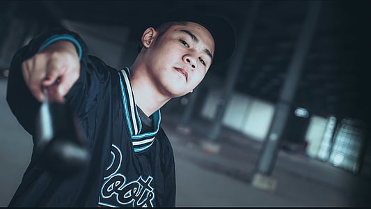 man wearing black and green jersey shirt thumbnail