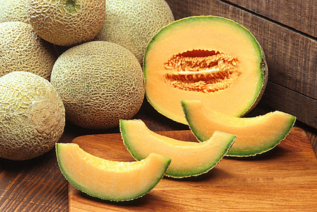 photo of sliced melon on brown chopping board thumbnail