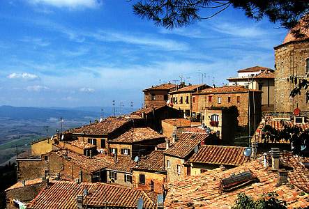brown concrete houses under blue sky photography thumbnail