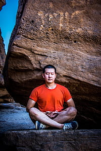 Man Meditating Under Rock thumbnail