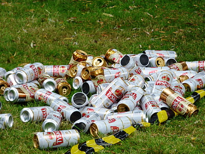 empty cans on grass field thumbnail