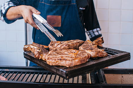 Cooked Meat On Black Metal Grill thumbnail