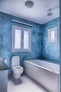 white ceramic sink, flash toilet and white window frame thumbnail