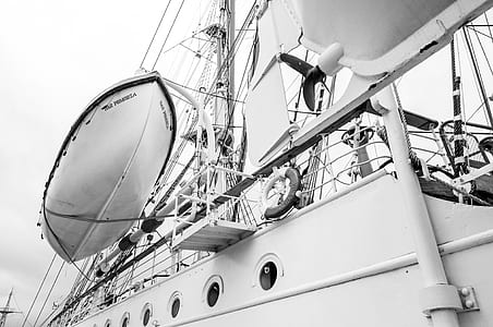 grayscale photography of a boat thumbnail