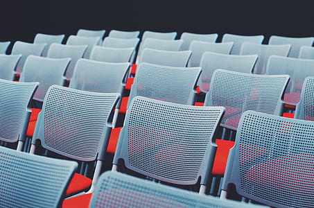 closeup photography of gray-and-red chairs thumbnail
