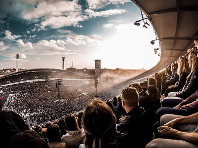 group of people sitting in stadium during daytime thumbnail