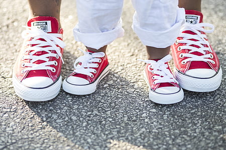 pair of boy's and men's red-and-white Converse All-Star low-tops thumbnail