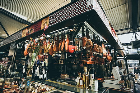 assorted meat hanging on stall thumbnail