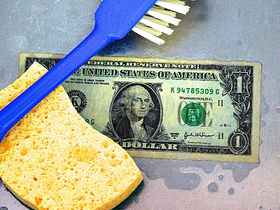 blue brush on sponge and 1 US dollar banknote thumbnail