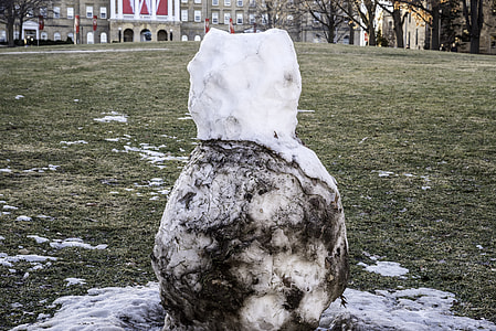 Mostly melted snowman in Madison, Wisconsin thumbnail