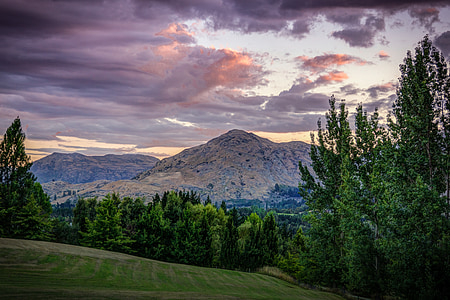 green grass field and view of mountain thumbnail