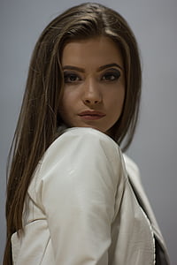 woman wearing white top taking picture thumbnail