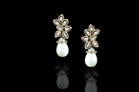 pair of white earrings thumbnail