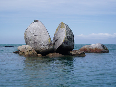 two big rocks surrounded by water thumbnail