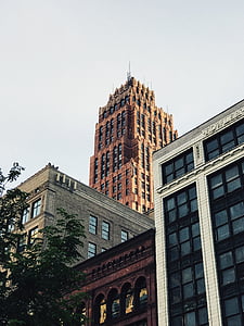 low-angle view of brown high rise building thumbnail