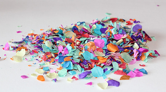 pile of assorted-color confetti on white surface thumbnail